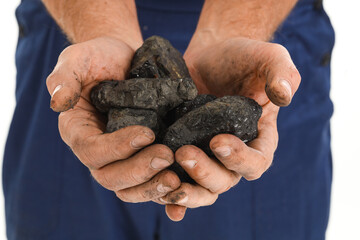 Mature miner man with coal on white background, closeup