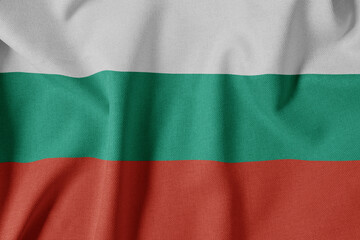 Obraz premium National Flag on Textured Fabric Background. Silk textured flag, realistic wave and flag look. BG Flag of Bulgaria
