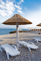 Beach umbrellas from straw in the resort village of Nebug