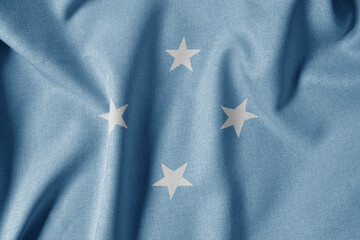 National Flag on Textured Fabric Background. Silk textured flag, realistic wave and flag look. FM  Flag of The Federated States of Micronesia - obrazy, fototapety, plakaty