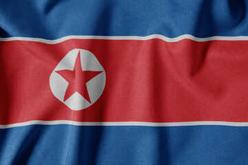 National Flag on Textured Fabric Background. Silk textured flag, realistic wave and flag look. KP  Flag of North Korea