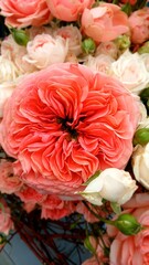 peony-shaped fluffy orange-pink roses in a bouquet