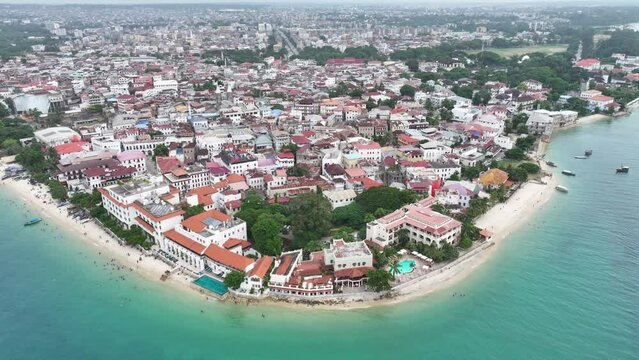 aerial video footage of famos Stone Town located in Zanzibar City on Zanzibar Island, Tanzania - overflying the historic district from west to east 