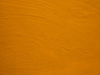 Dark yellow color abstract texture background with smudged paint for design purpose