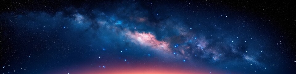 Nebulous Clouds and Stars in a Dark Blue Sky over a Horizon Illuminated by a Red Glow - obrazy, fototapety, plakaty