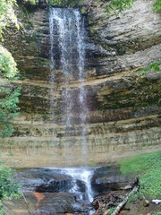 Waterfall over natural rocks