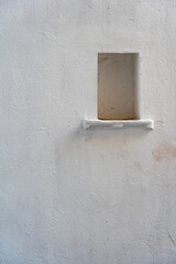 White wall background with a niche in city Udaipur, Rajasthan, India. Closeup, copy space