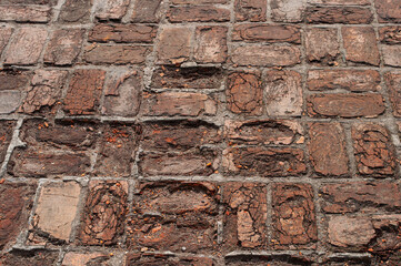 Fragment of old brick pavement texture in ancient monastery