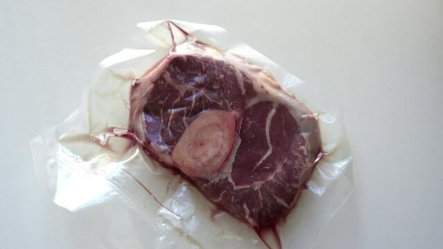 Close-up of vacuum-sealed packaging organic beef (osso buco)