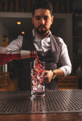 Barman making cocktail
