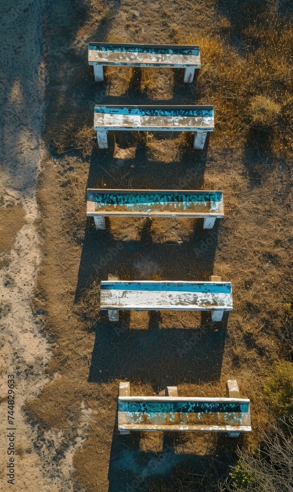 Poster an aerial view of a row of benches. generative ai.