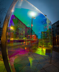 Urban street seen through colorful public glass