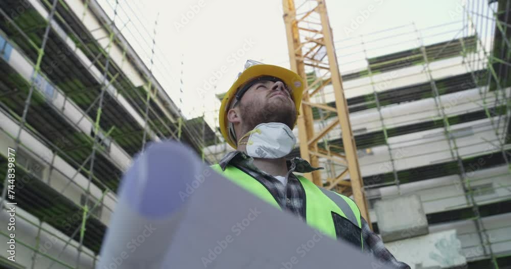 Poster Architect, man and blueprint paper in city, construction site and thinking of industrial development. Document, design and engineer with floor plan, building infrastructure and reading in low angle