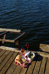 Obraz premium Picnic on the river with liver pate and wine