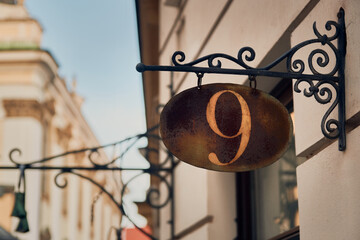 Nine - the number of the building on the rusting plate
