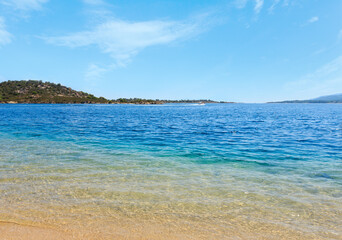 Summer Aegean sea coast landscape (Livari beach, Halkidiki, Sithonia, Greece). People are...