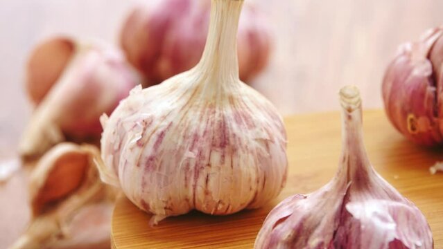 Gyration old garlic on a wooden table background.