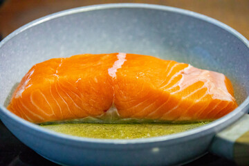 Salmon fish grilled in butter and olive oil
