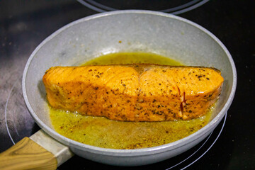Salmon fish grilled in butter and olive oil