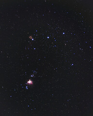 The Constellation Orion. Orion's Belt shining bright in the dark night sky. The Orion Nebula and the Flame Nebula are both visible as well as the running man and horsehead nebula being barely seen. - obrazy, fototapety, plakaty