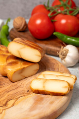 Smoked Circassian cheese. Smoked Circassian cheese on a cutting board. local name isli cerkez peyniri. Close up