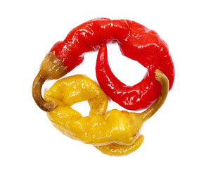 Hot, sour red and green pepperoni pepper in shape ying yang symbol isolated on white background,...