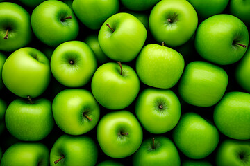 A full frame of vibrant green apples neatly arranged.