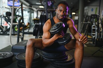 Fototapeta na wymiar African American man working out in the gym.