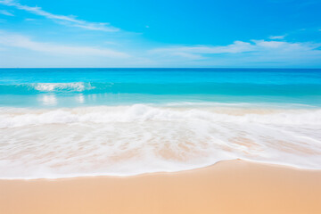 Fototapeta na wymiar The serene blue ocean meeting the sandy beach with gentle waves under a clear sky.