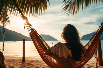 Silhouette of a person relaxing in a hammock by the beach at sunset, embodying peace and solitude