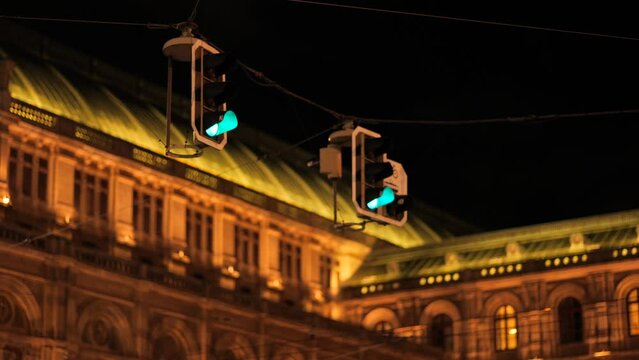 Green and Red Traffik Lights at Vienna State Opera at Night and Tramway at the Ring Road Handheld Video