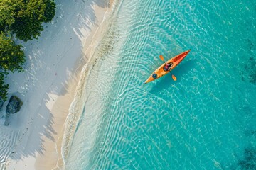 Aerial View of Kayak on Clear Blue Tropical Waters Near Sandy Beach