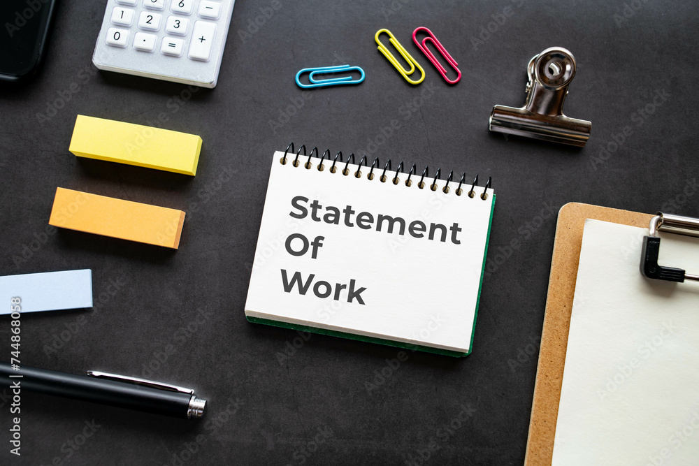 Aufkleber there is notebook with the word statement of work. it is as an eye-catching image.