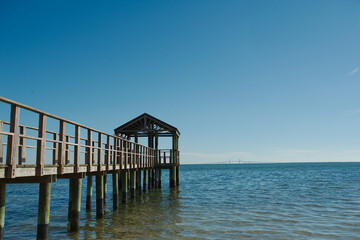View out Bay Vista Park  with a pier on the left  with leading lines of wood pier  towards Tampa...
