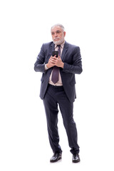 Old businessman talking by phone isolated on white