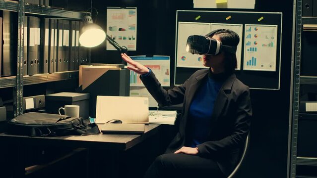 Law enforcement agent works with virtual reality glasses in incident room, reenacting crime timeline with artificial intelligence innovation. Officer uses visual interactive vr headset. Camera A.