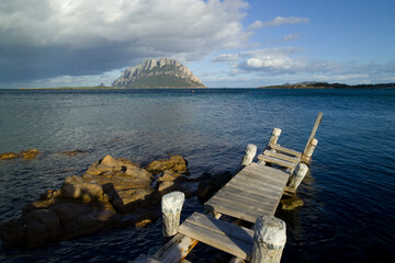 wooden pier on the beach, Porto San Paolo, Isola di Tavolara. Olbia Tempio. Sardegna, Italia