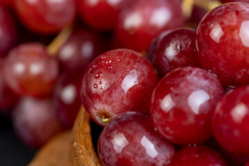 large red wet grapes in drops of water