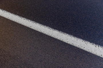 Fototapeta premium old road markings on the highway in winter