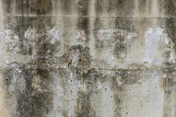 A concrete wall with moisture stains