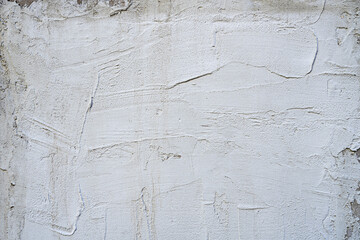 A gray cement wall with layers of white plaster carelessly troweled. Vector cement texture...