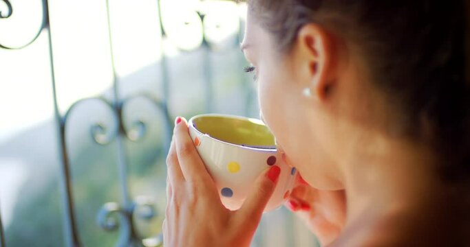Woman, drinking coffee and relaxing on balcony outdoors, peaceful view and calming tea on vacation. Female person, hot cup and daydreaming on summer holiday, terrace and cozy or travel to hotel