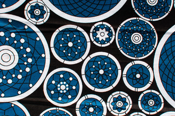 top view of blue ankara fabric, flatlay of nigerian wax cloth with designs, spread out blue ankara...
