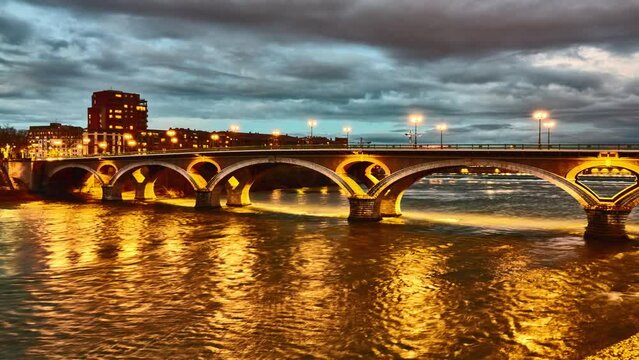Timelapse Bridge of Catalans (Amidonniers Bridge) is Toulouse, France bridge crossing Garonne river. It is bridge in arch and stone and reinforced concrete inaugurated in 1908. Architect Paul Sejourne