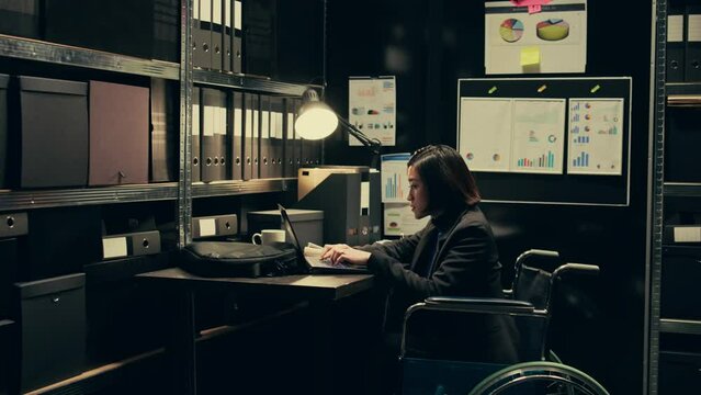 Wheelchair user and inspector analyzing criminal records in police archive room, cross reference data from cases to identify similarities. Team of agents compile notes on crime trends. Camera B.