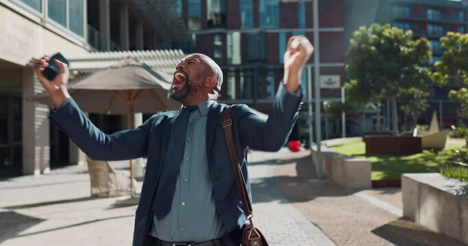 Business, celebration and black man with phone in a city street for news, success and winner fist victory. Smartphone, app and mature male entrepreneur outdoor with competition prize, reward or bonus