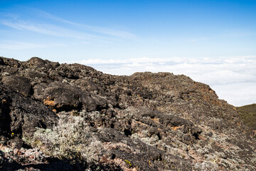 Above the Clouds: Rugged Terrain Meets Endless Sky