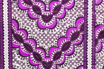 top view of purple ankara fabric, flatlay of nigerian wax cloth with designs, spread out purple ankara material