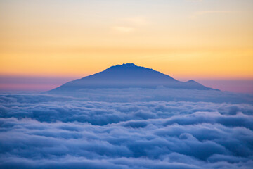 Golden Horizon: A Majestic Sunset Over Mt. Meru