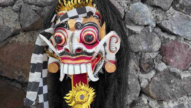 Traditional Leak Rangda Mask costume for a Bali Dance theater performance. Handcrafted masks in the form of legendary demons in Bali, Indonesia.